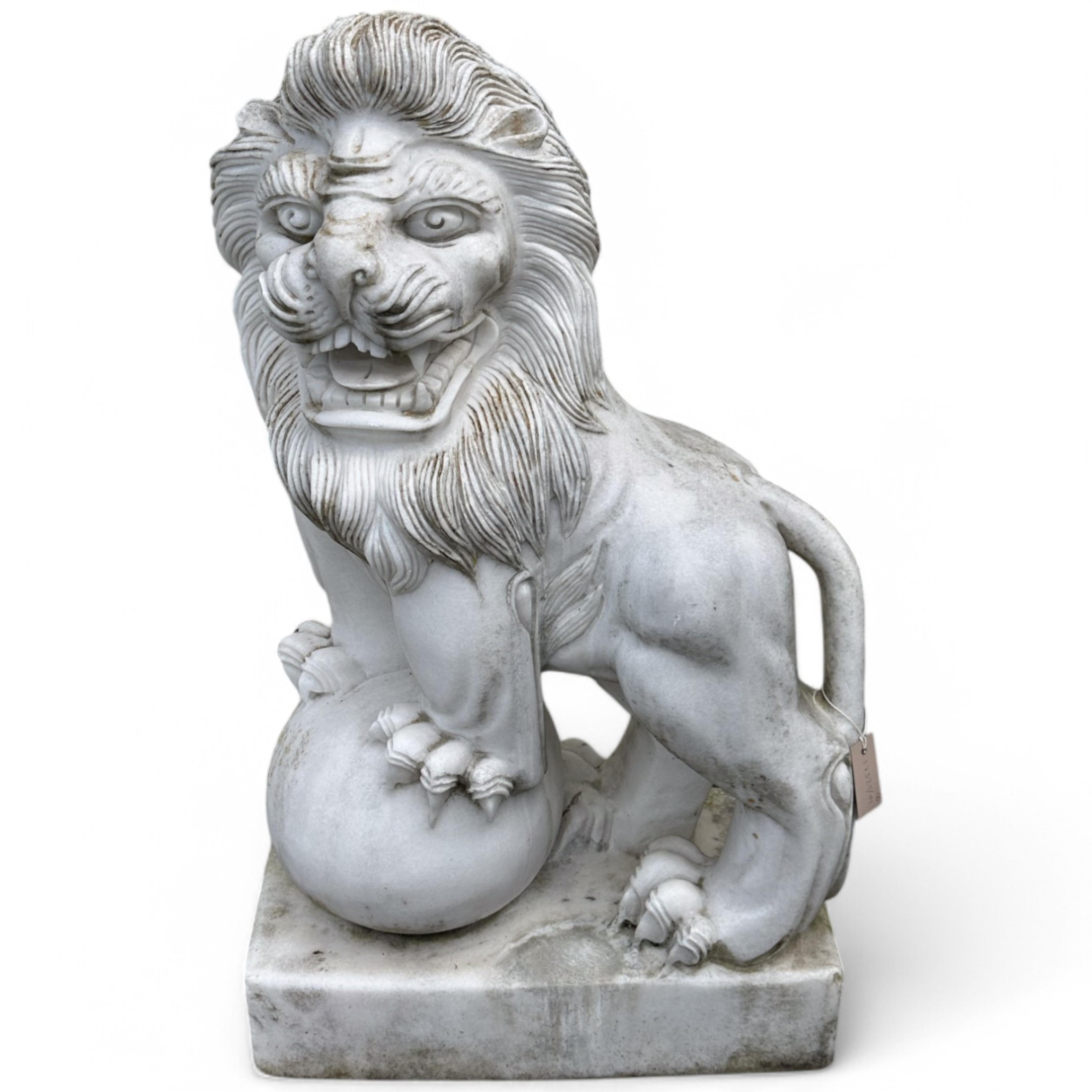 A pair of reconstituted white marble models of lions rampant